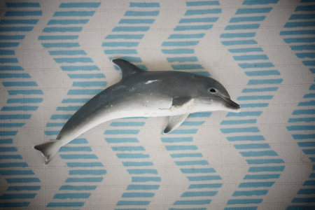 Poznan, Poland - May 1, 2023: A Schleich brand toy dolphin figurine.のeditorial素材