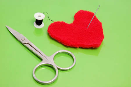 fashioned heart from textile materia by scissorsの写真素材