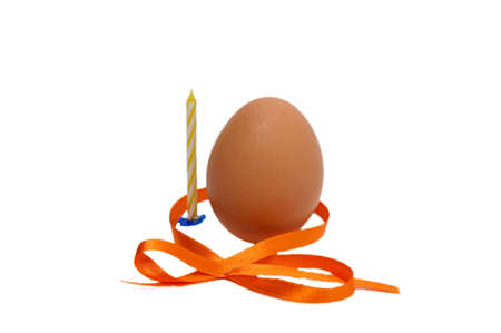 tradition decorated eggs by ribbon and Candle in easterの写真素材