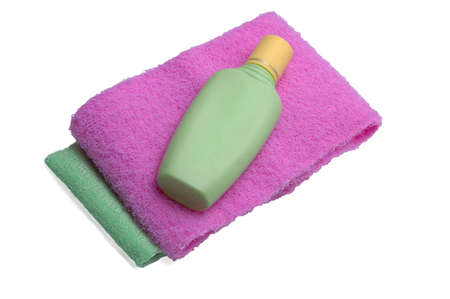 color sponges and shampoo in plastic bottleの写真素材