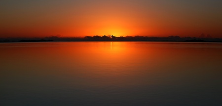 Still Morning Sunrise Over The Coral Seaの写真素材