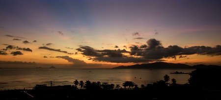 A cloudy sunrise over the south china sea and vinpearl island Vietnam.の写真素材
