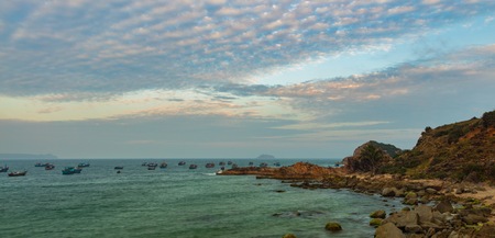 A rocky coastline fishing port looking out over the south China sea in Vung Lam Bay Vietnam.の写真素材