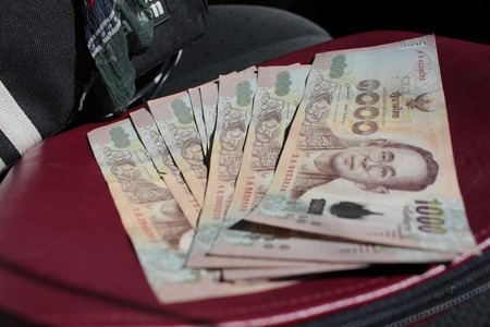 blurry and select focus of thai  banknotesの写真素材