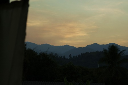 sunrise behind mountainsの写真素材