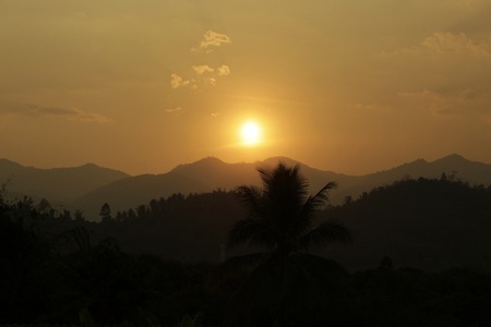 sunrise behind mountainsの写真素材
