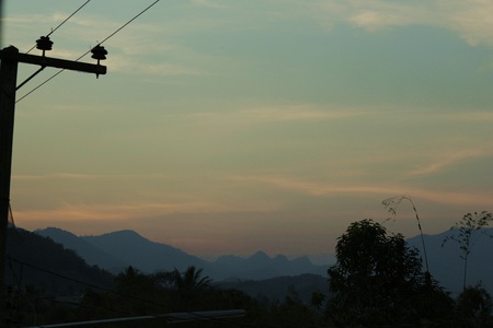 sunrise behind mountainsの写真素材