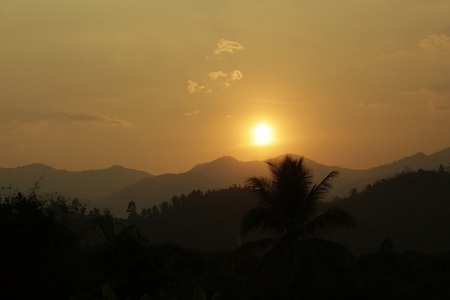 sunrise behind mountainsの写真素材