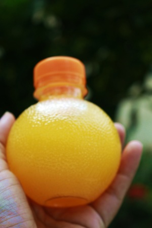 a bottle with orange juiceの写真素材