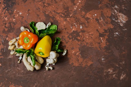 Different vegetables and fruits on a brown backgroundの写真素材