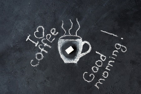 Chalk coffee Cup on a black background. The conceptの写真素材