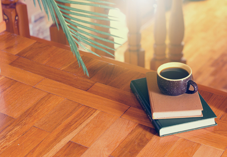 Wooden steps coffee and books houseplant. A place for reading and relaxing. Rustic style interiorの写真素材