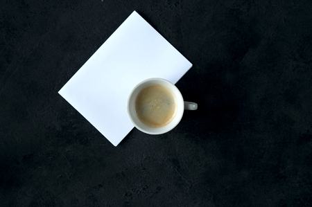 Coffee Cup card for inscriptions wishing good morning on a black background.の写真素材