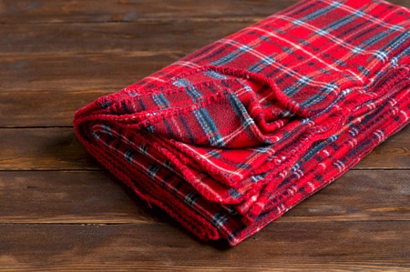 The red blanket on wooden backgroundの写真素材