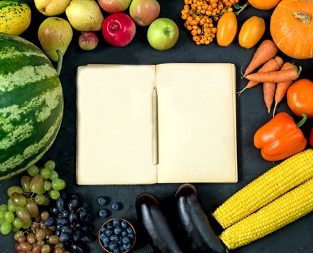 Autumn vegetables and fruits on black background