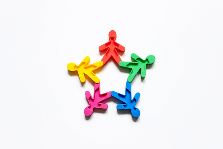 Friendship of peoples is a symbol of colored men on a white background.の写真素材