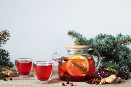 Fruit and berry tea with cranberries orange rosemary and cinnamon. Healthy drinks.の写真素材