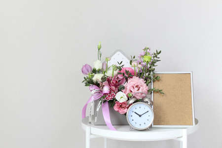 A bouquet of flowers for a woman on the bedside table on the day of the holiday on March 8, St....