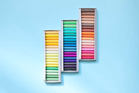 Colorful chalk crayons for drawing on a blackboard and on asphalt. Top view