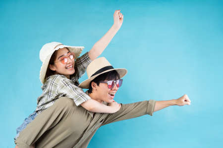 Young Asian couple happily traveling together