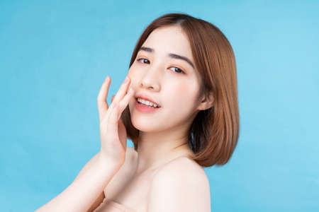 Attractive young Asian woman with youthful skin. Facial care, facial treatment, woman beauty skin...
