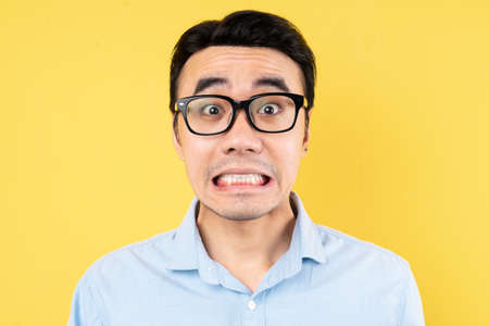 male portrait wearing shirt, isolated on yellow backgroundの写真素材