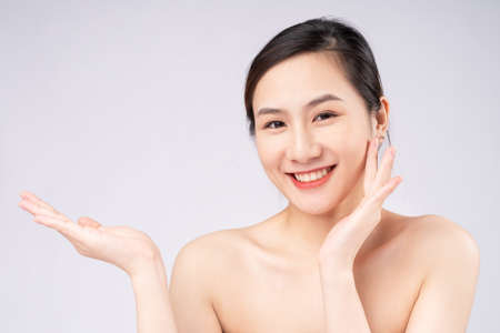 Beautiful young asian woman with clean fresh skin on white background,の写真素材