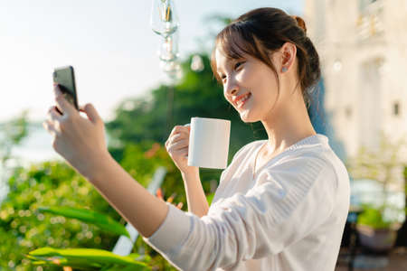 Portrait of a beautiful young Asian girl in the sunset