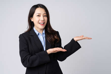 full body image of beautiful young asian businesswoman, isolated on white backgroundの写真素材