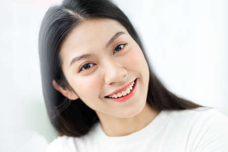 image of asian woman preparing salad in the kitchenの写真素材