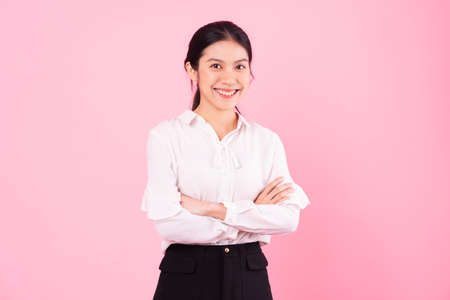 beautiful asian female portrait, isolated on pink backgroundの写真素材
