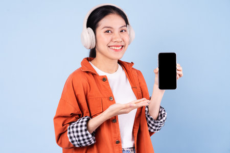 young asian girl image, isolated on blue background