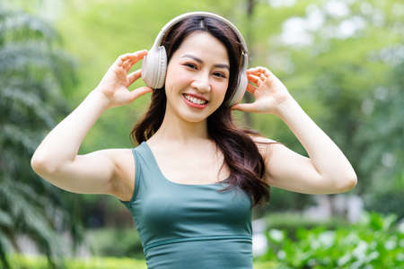 Asian woman exercising at the park
