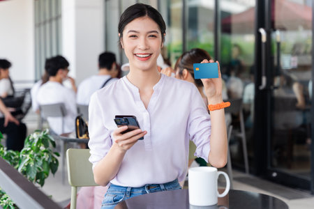 Portrait of beautiful asian woman sitting at cafeの写真素材