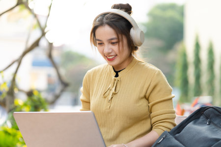 Portrait of a beautiful Asian female student at universityの写真素材