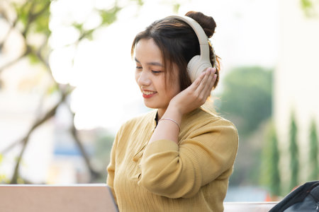 Portrait of a beautiful Asian female student at universityの写真素材