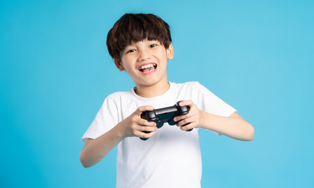 Asian boy portrait on blue background