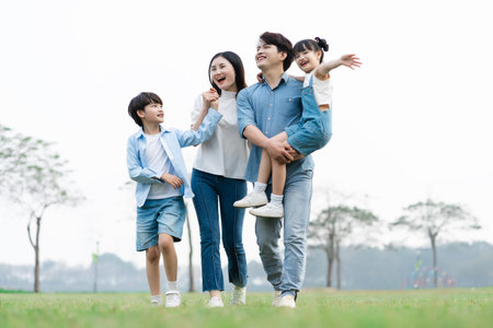 Asian family photo walking together in the parkの写真素材