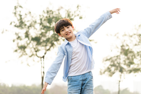Asian boy portrait in the parkの写真素材