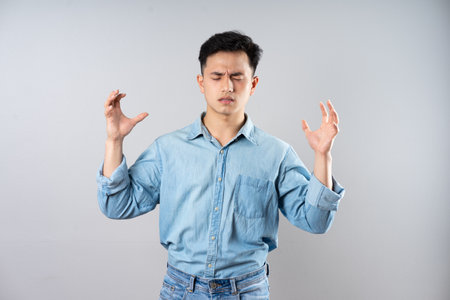 image of young businessman male on gray backgroundの写真素材
