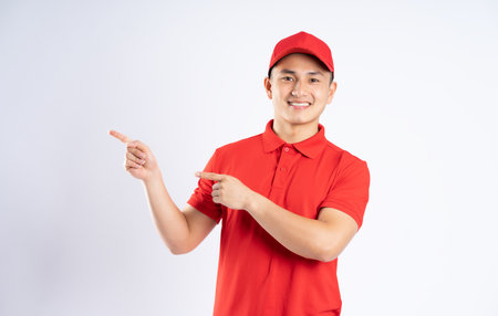portrait of asian delivery man on white backgroundの写真素材