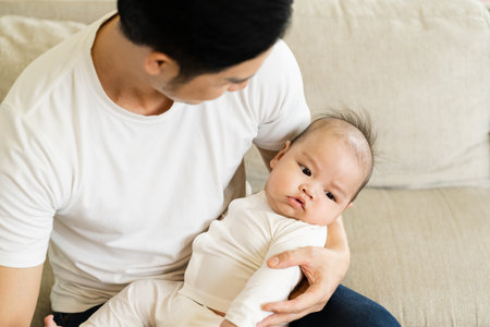 image of asian father and son at homeの写真素材