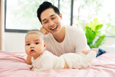 image of asian father and son at homeの写真素材
