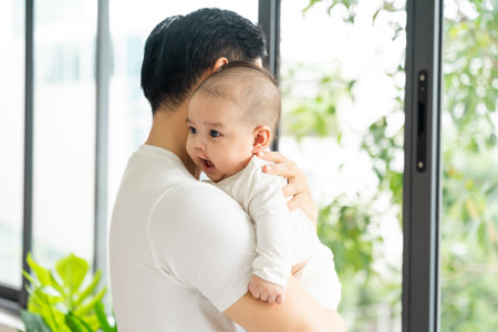 image of asian father and son at homeの写真素材