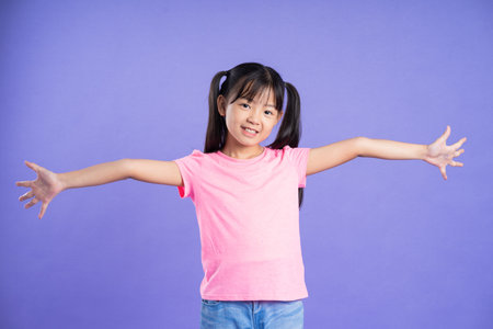 beautiful asian girl portrait posing on purple backgroundの写真素材