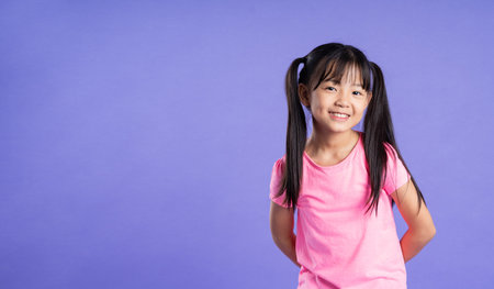 beautiful asian girl portrait posing on purple backgroundの写真素材