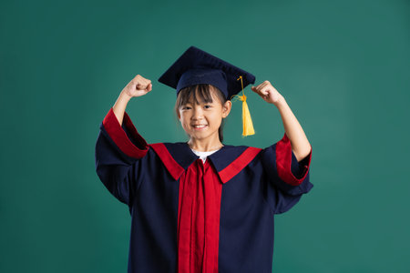 beautiful asian girl posing on blue backgroundの写真素材