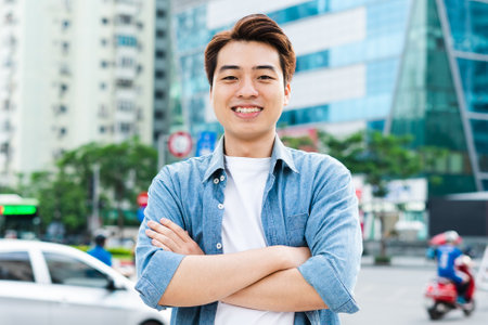 Asian man walking on the streetの写真素材