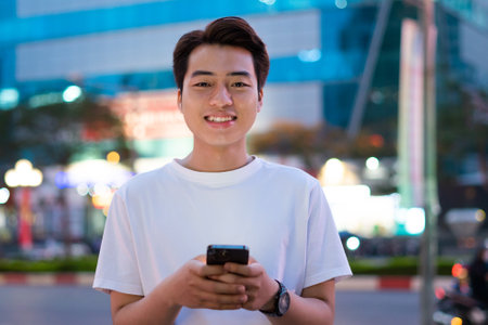 Asian man portrait in the street at night
