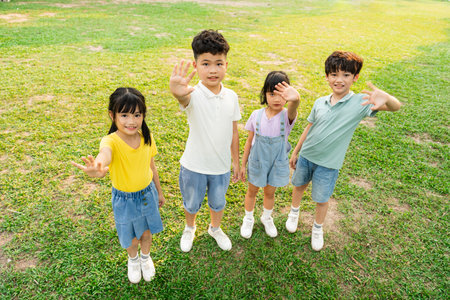 group of cute asian kids having fun in the parkの写真素材